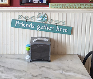 Daddy-Cates-friends-sign Friends gather here